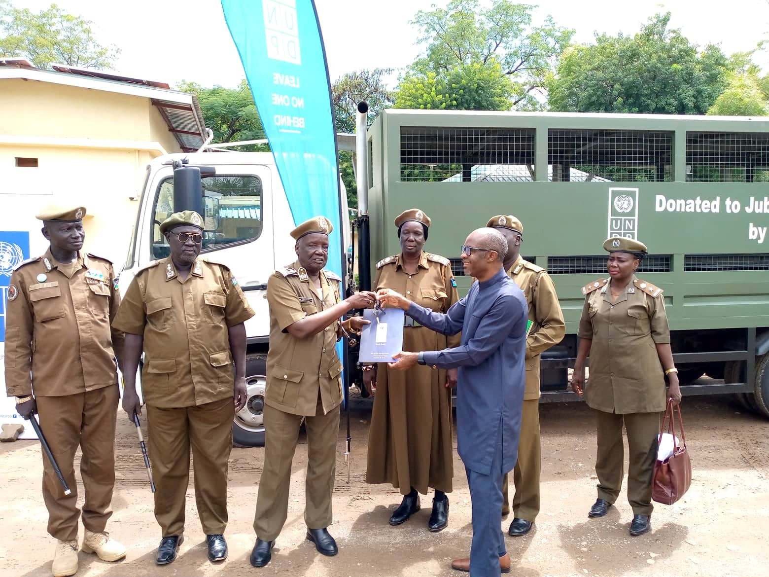 UNDP donates two new caged trucks to prison services